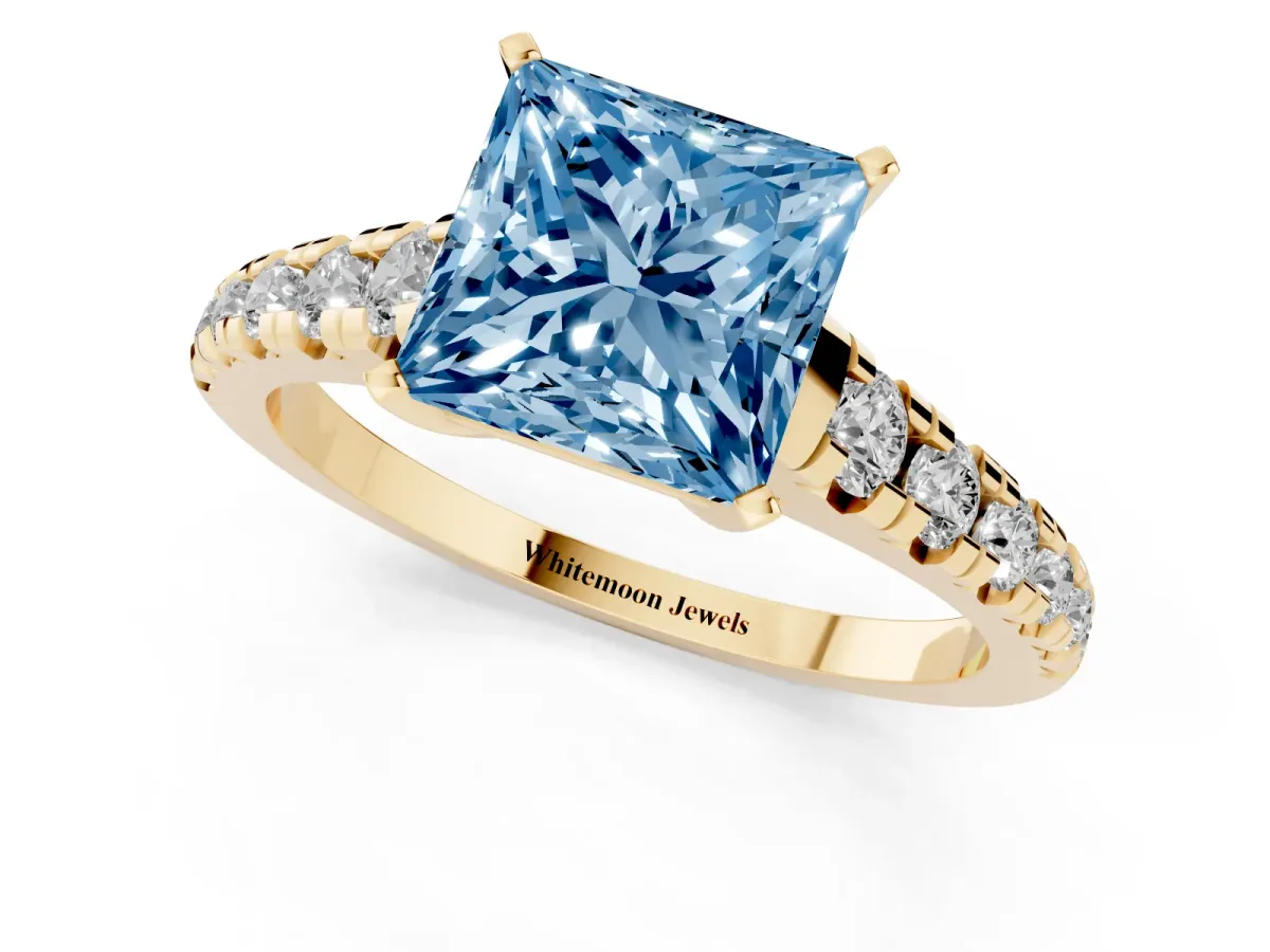 Fancy Blue Princess Cut Diamond Cathedral Solitaire Ring with Round Pavé Band Yellow gold