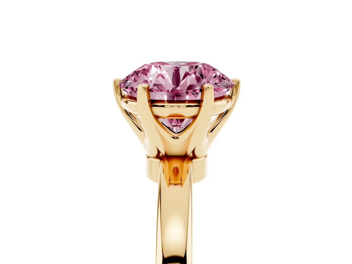 Fancy Pink Round Cut Solitaire Diamond Ring with Six-Prong Setting on a Classic Band Yellow gold