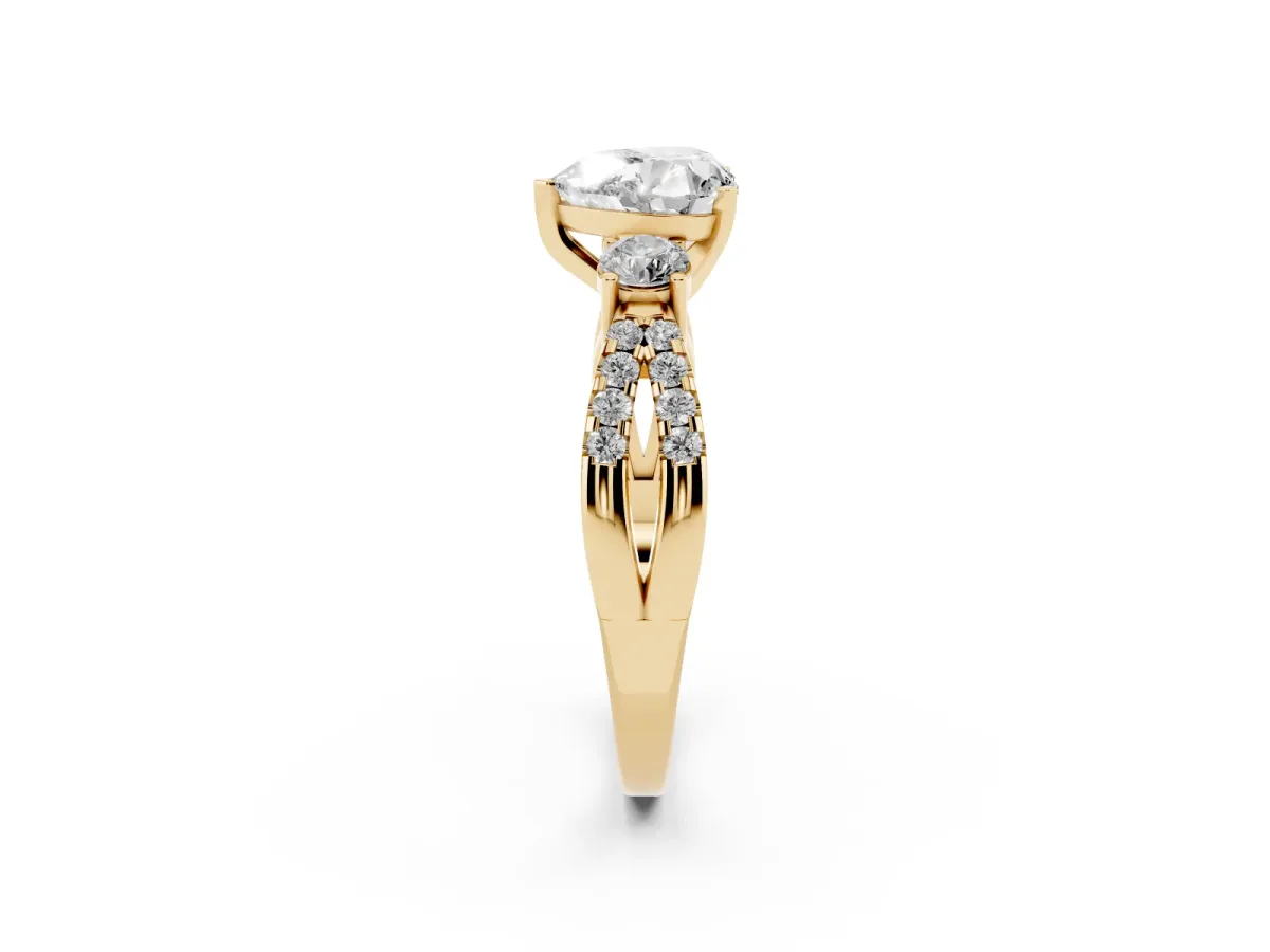 Heart Cut Diamond Three-Stone Ring with Pavé Split Shank and Four-Prong Setting Yellow gold