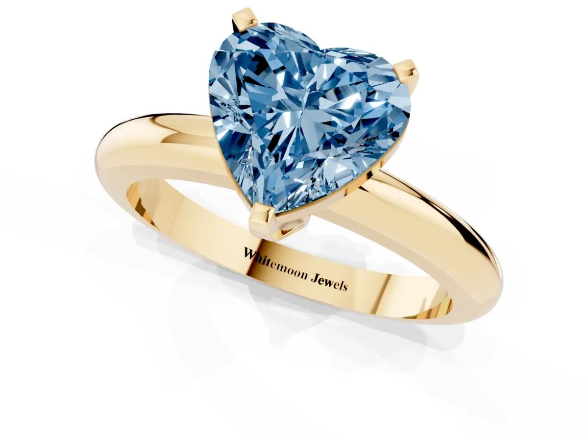 Fancy Blue Heart Cut Diamond Solitaire Engagement Ring with Round Band and Four-Prong Setting Yellow gold