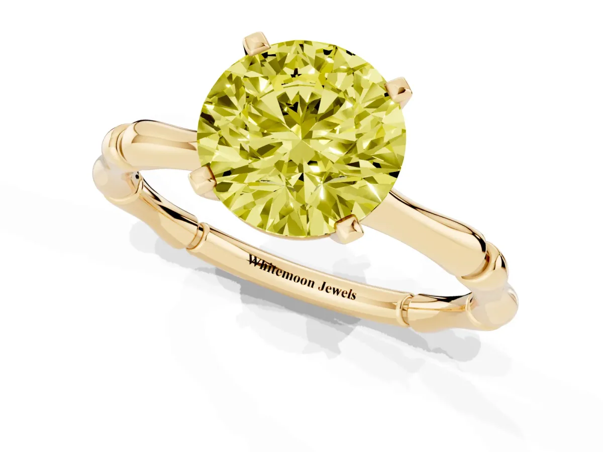 Fancy Yellow Round Cut Solitaire Diamond Ring with Bamboo Band and Four-Prong Setting Yellow gold