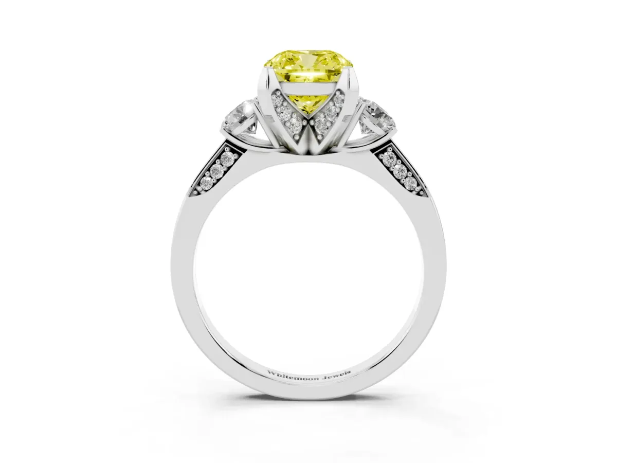 Fancy Yellow Cushion Cut Brilliant Three-Stone Diamond Ring with Pavé Band and Four-Prong Setting Platinum