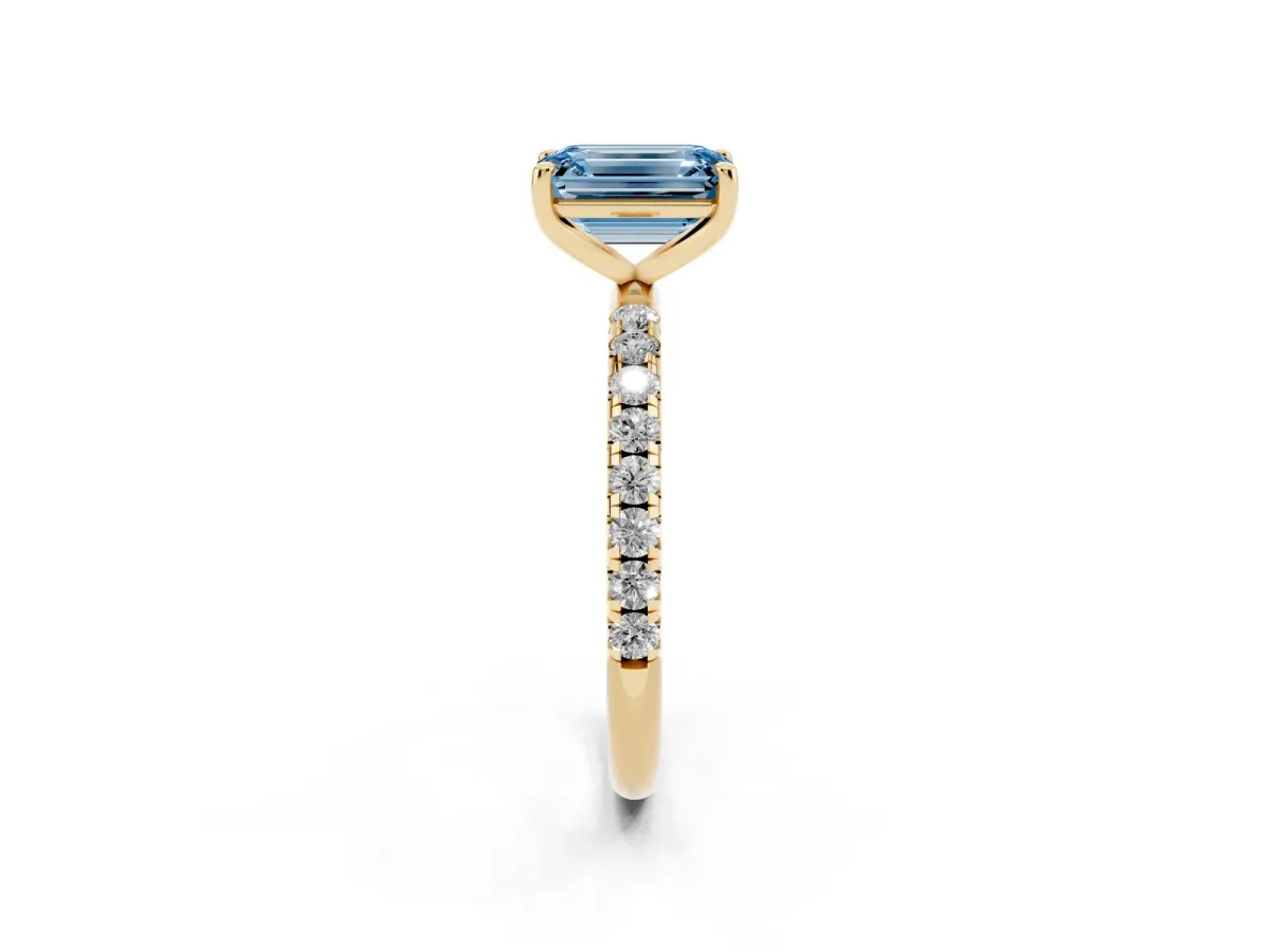 Fancy Blue Emerald Cut Cut Diamond Solitaire Ring with Micro Pave Band and Four Prong Setting Yellow gold