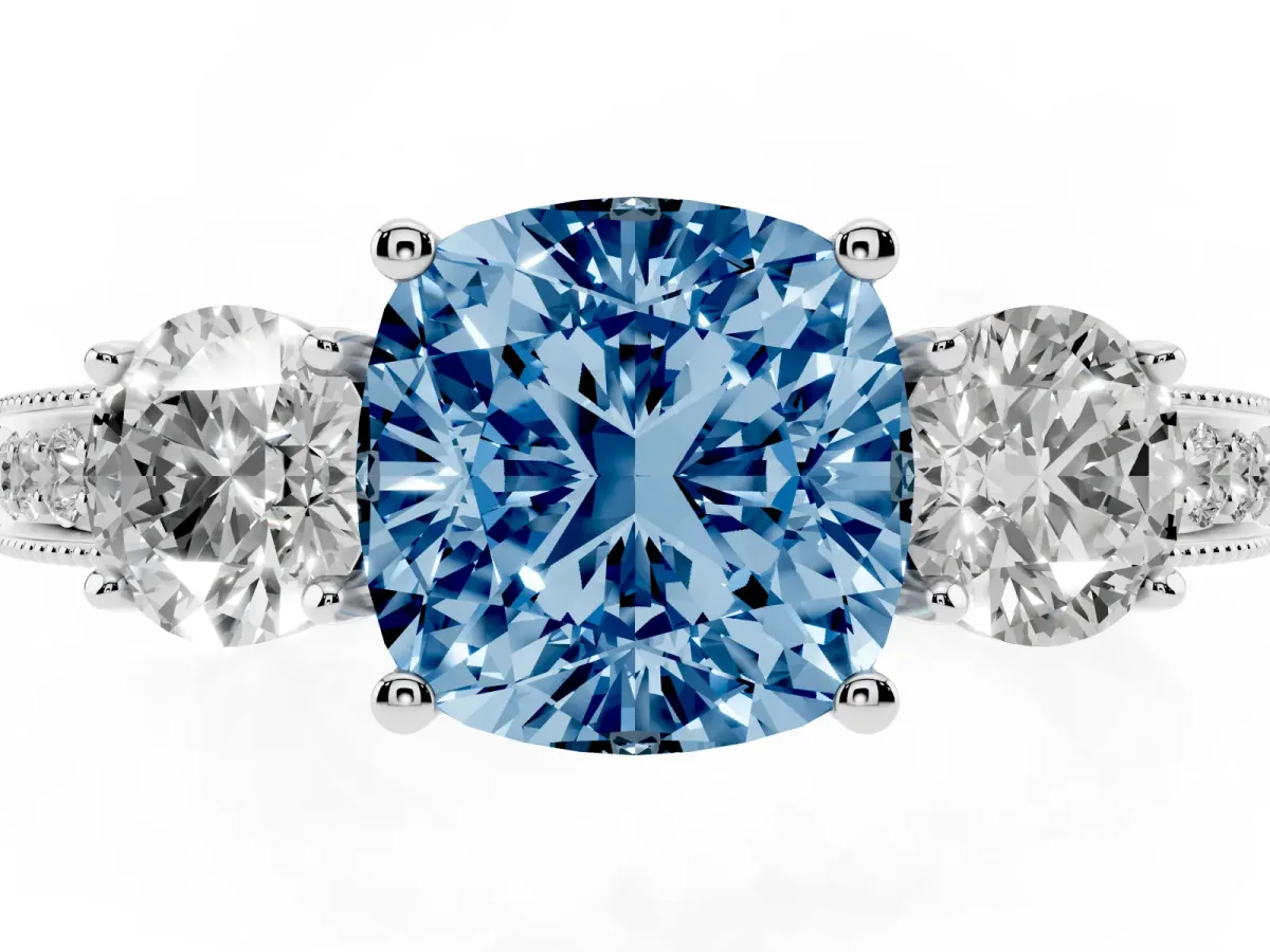Fancy Blue Cushion Cut Three-Stone Diamond Ring with Pavé Band and Four-Prong Setting Silver