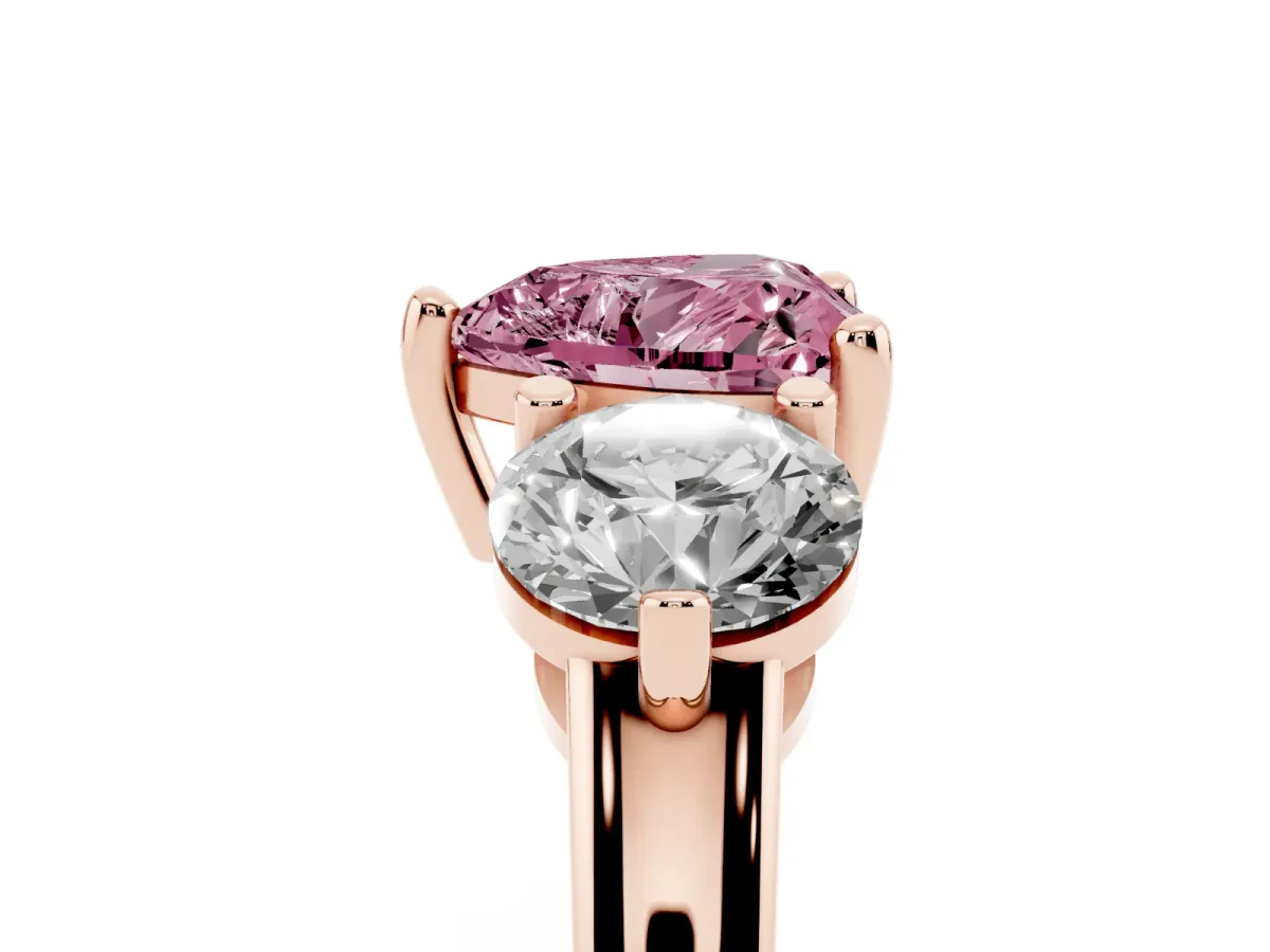 Fancy Pink Three-Stone Heart Cut Brilliant Cut Solitaire Ring with Prong Setting on a Classic Band Rose gold