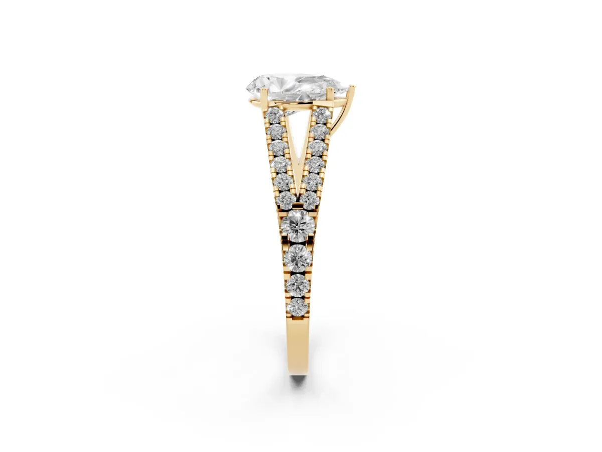 Pear Cut Diamond Split Shank Engagement Ring with Round Pavé and Prong Setting Yellow gold