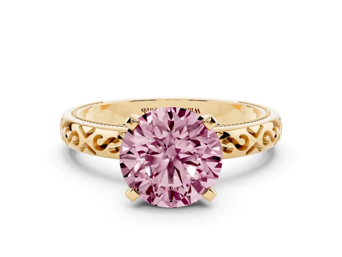 Fancy Pink Round Cut Solitaire Engagement Ring with Scrollwork Band and Four-Prong Setting Yellow gold