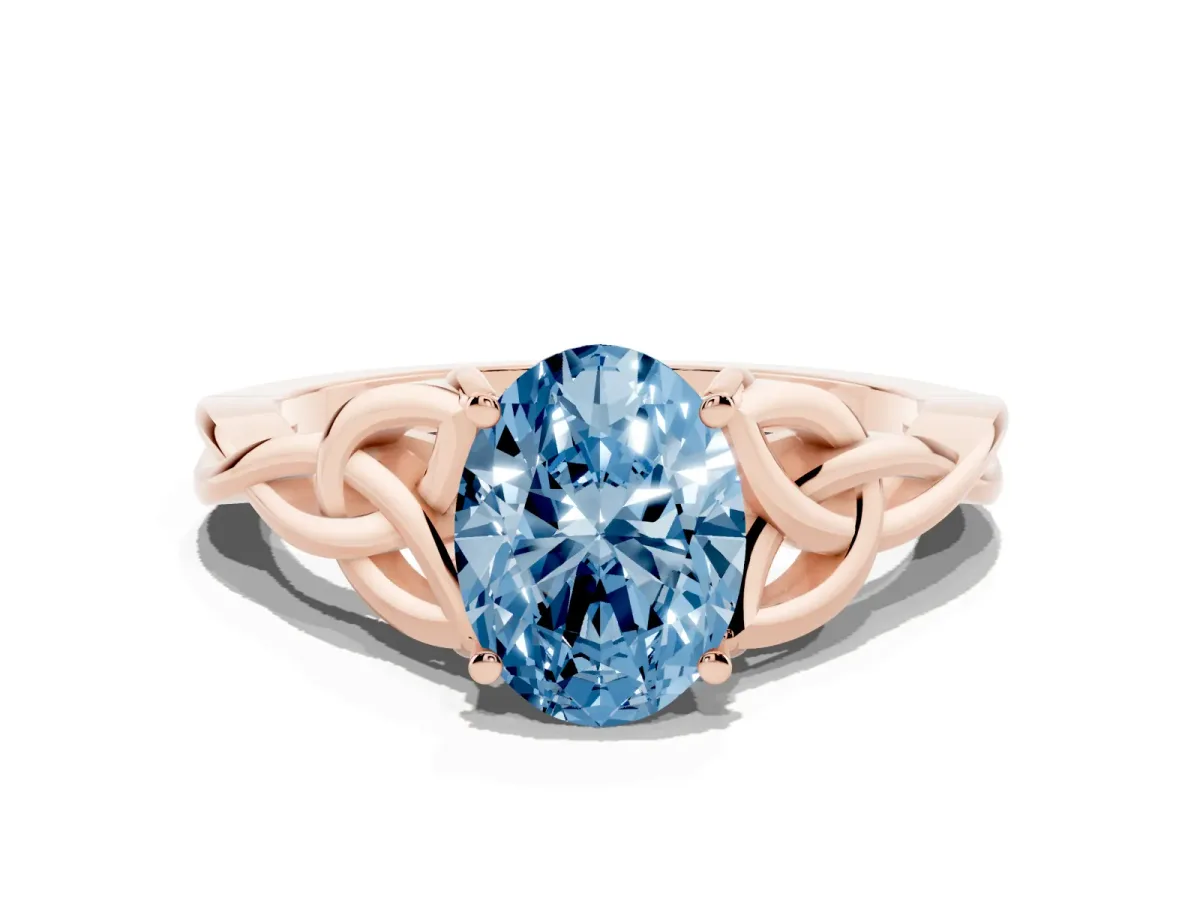 Fancy Blue Oval Cut Diamond Solitaire Engagement Ring with Celtic Knot Band and Four-Prong Setting Rose gold