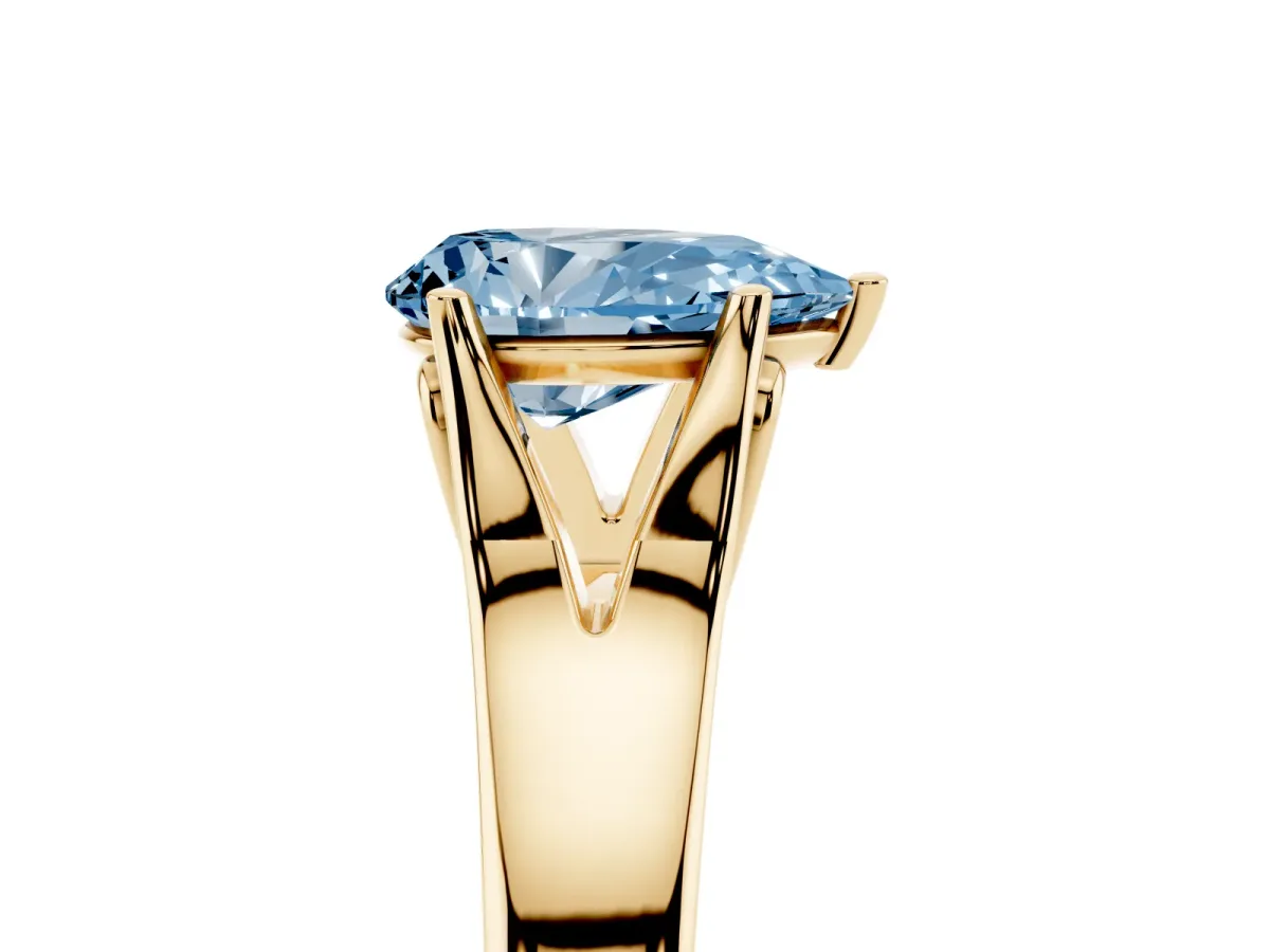 Fancy Blue Pear Cut Solitaire Diamond Ring with Cathedral Band and Four-Prong Setting Yellow gold