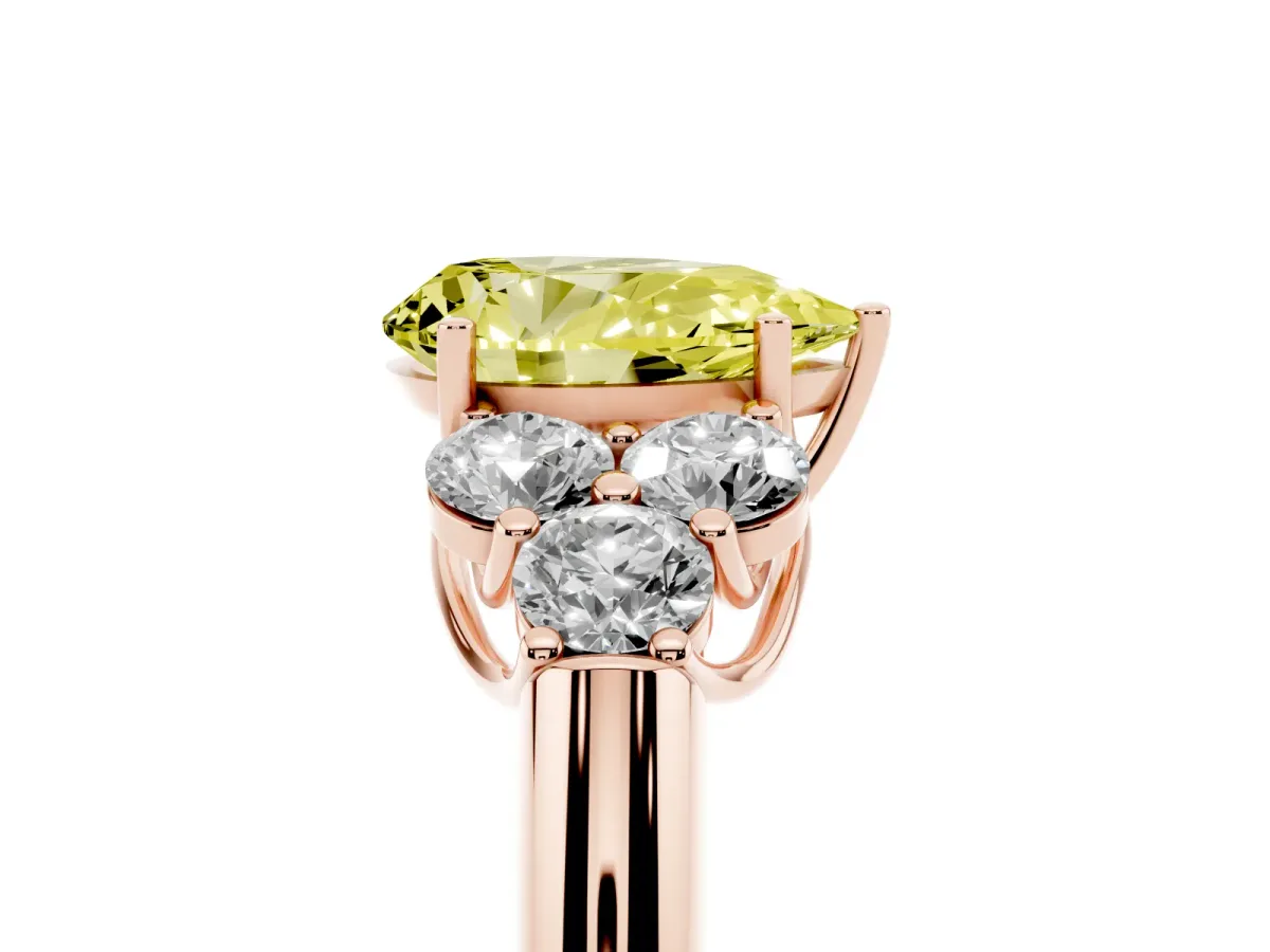 Fancy Yellow Pear Cut Cut Diamond Cluster Ring with Round Accent Stones and Prong Setting on a Classic Band Rose gold