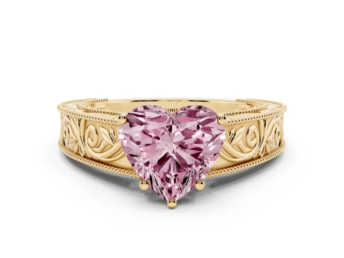 Fancy Pink Heart Cut Diamond Solitaire Ring with Engraved Band and Four-Prong Setting Yellow gold
