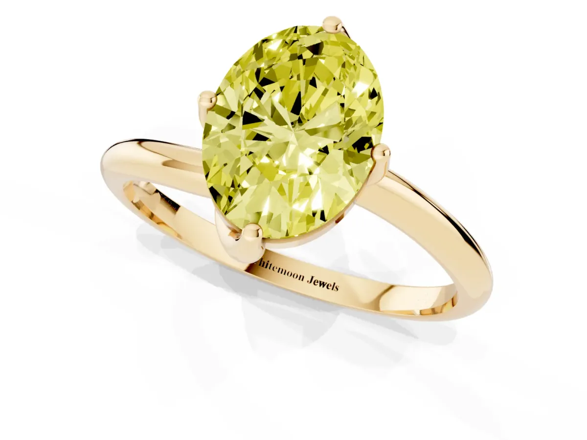 Fancy Yellow Oval Cut Diamond Solitaire Engagement Ring with Four-Prong Setting and Classic Band Yellow gold