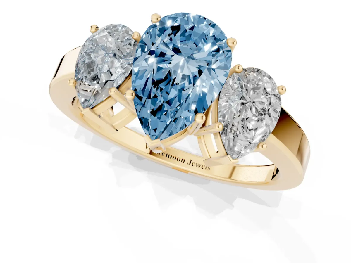 Fancy Blue Three-Stone Pear Cut Cut Diamond Engagement Ring with Flat Band and Four-Prong Setting Yellow gold