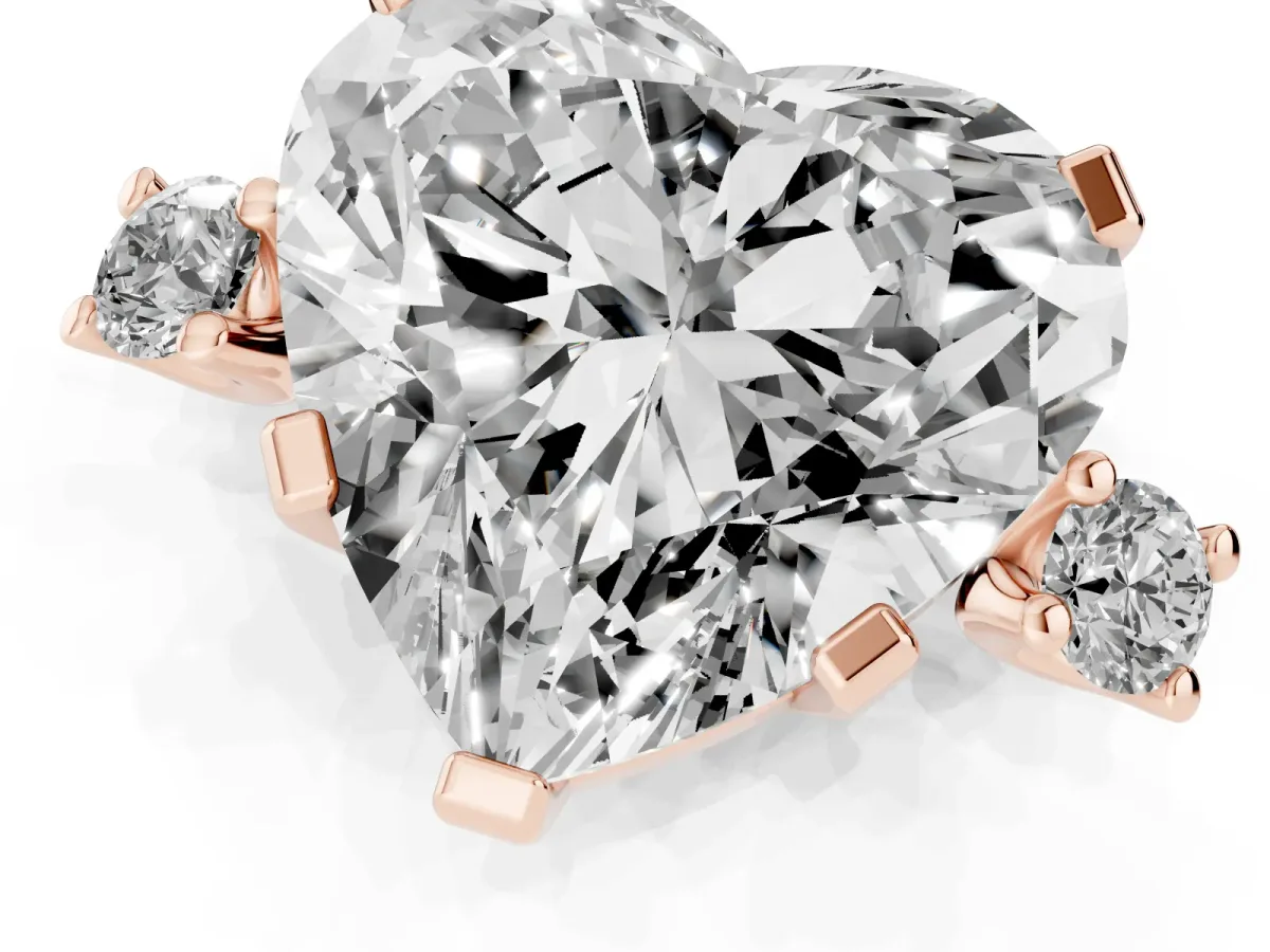 Heart Cut Cut Three-Stone Solitaire Ring with Round Accent Diamonds and Four-Prong Setting Rose gold