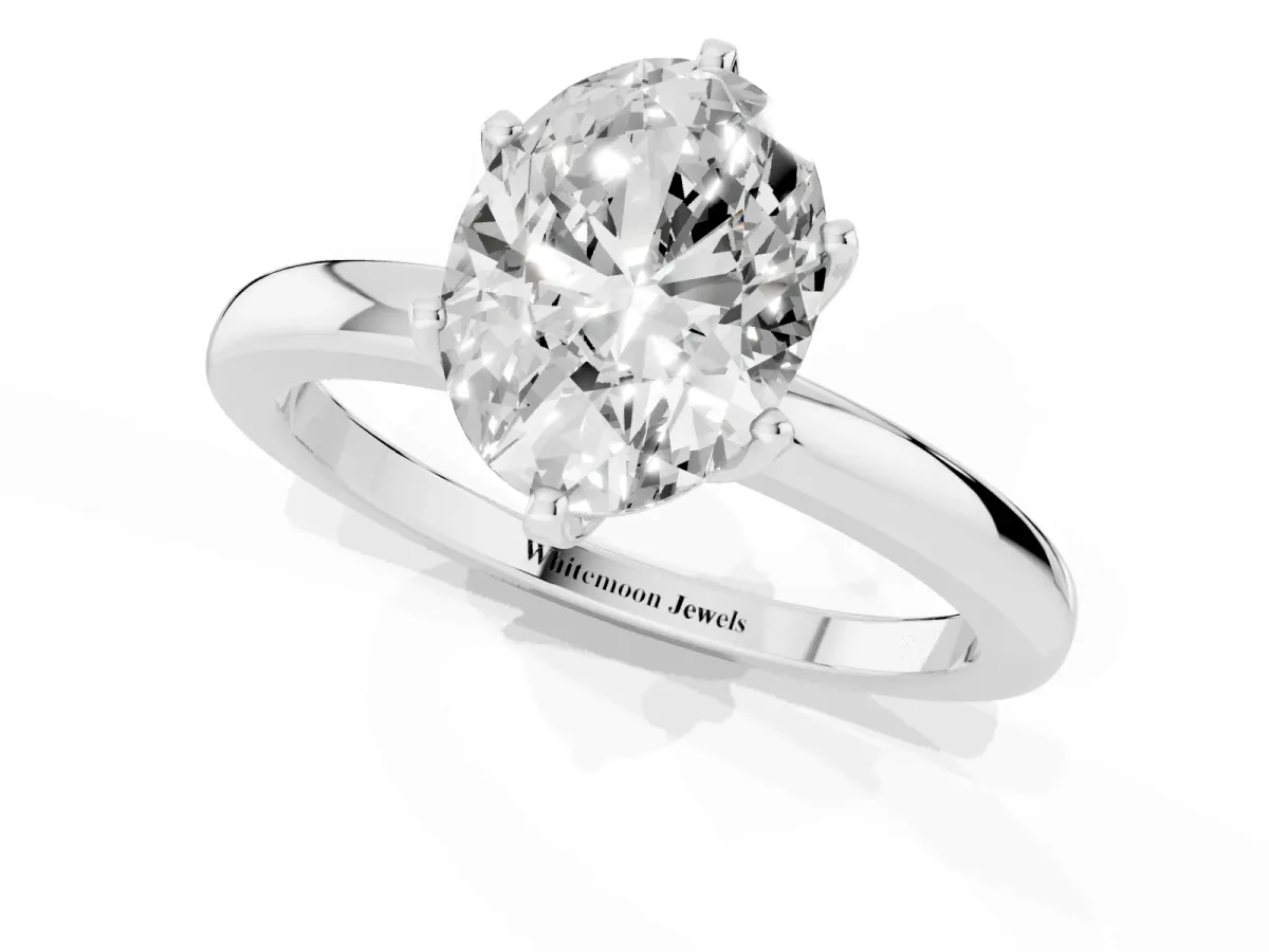 Oval Cut Solitaire Diamond Ring with Six-Prong Setting on a Classic Band White gold