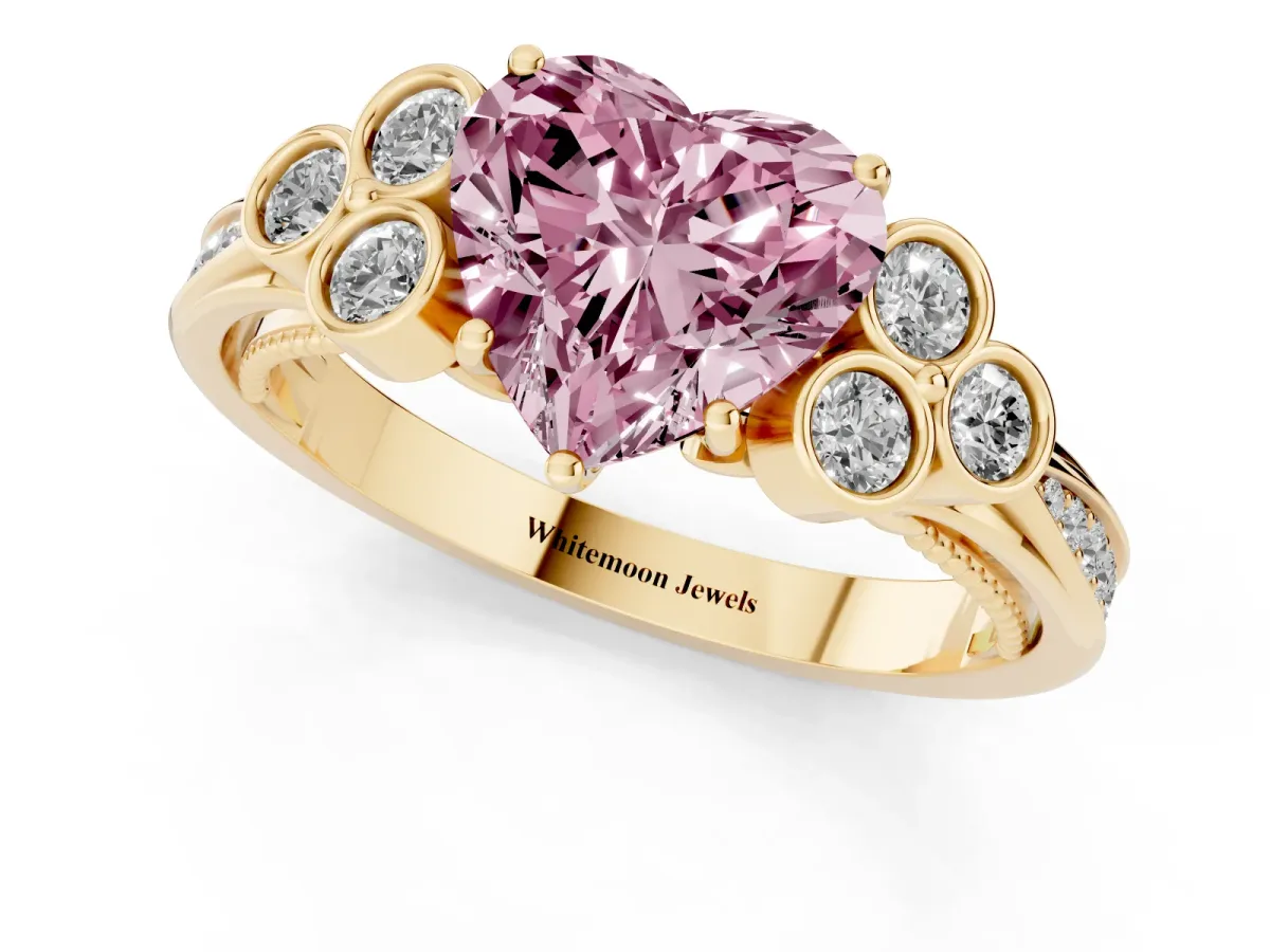 Fancy Pink Heart Cut Cut Diamond Engagement Ring with Bezel Set Round Side Stones and Prong Setting Yellow gold