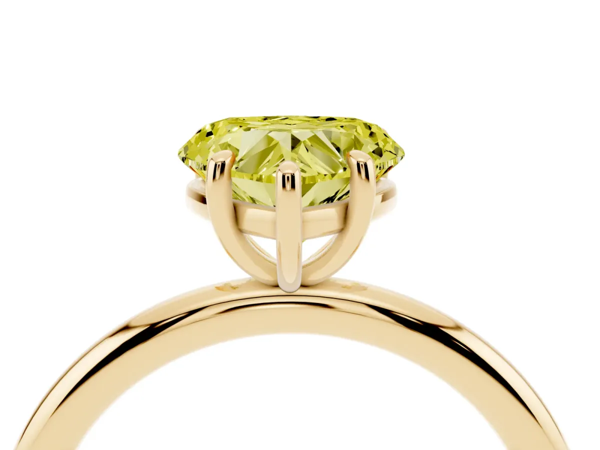 Fancy Yellow Heart Cut Solitaire Diamond Ring with Four-Prong Setting on a Plain Band Yellow gold