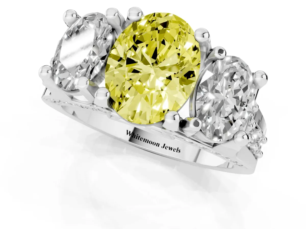 Fancy Yellow Oval Cut Diamond Three-Stone Ring with Channel Set Band and Four-Prong Setting Silver