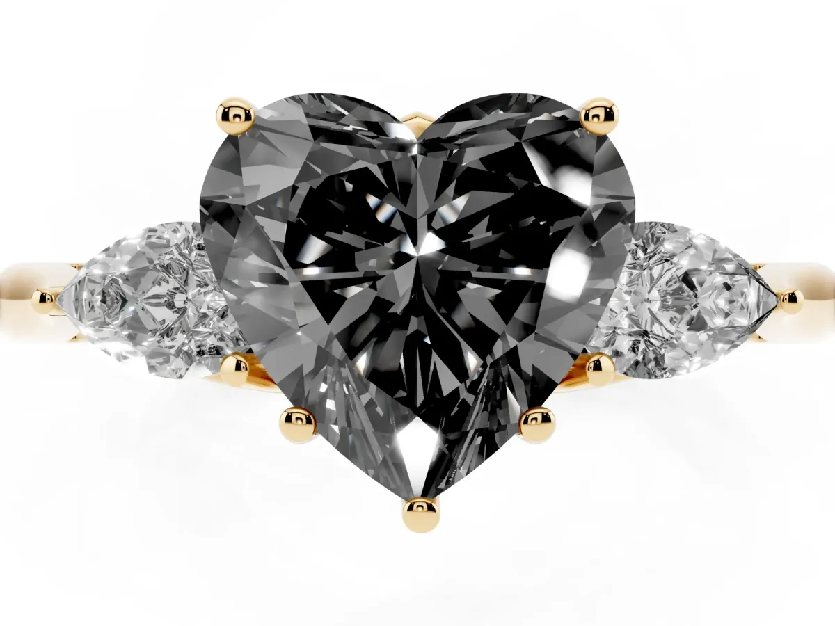 Fancy Black Three-Stone Heart Cut Brilliant Diamond Solitaire Ring with Tapered Band and Four-Prong Setting Yellow gold