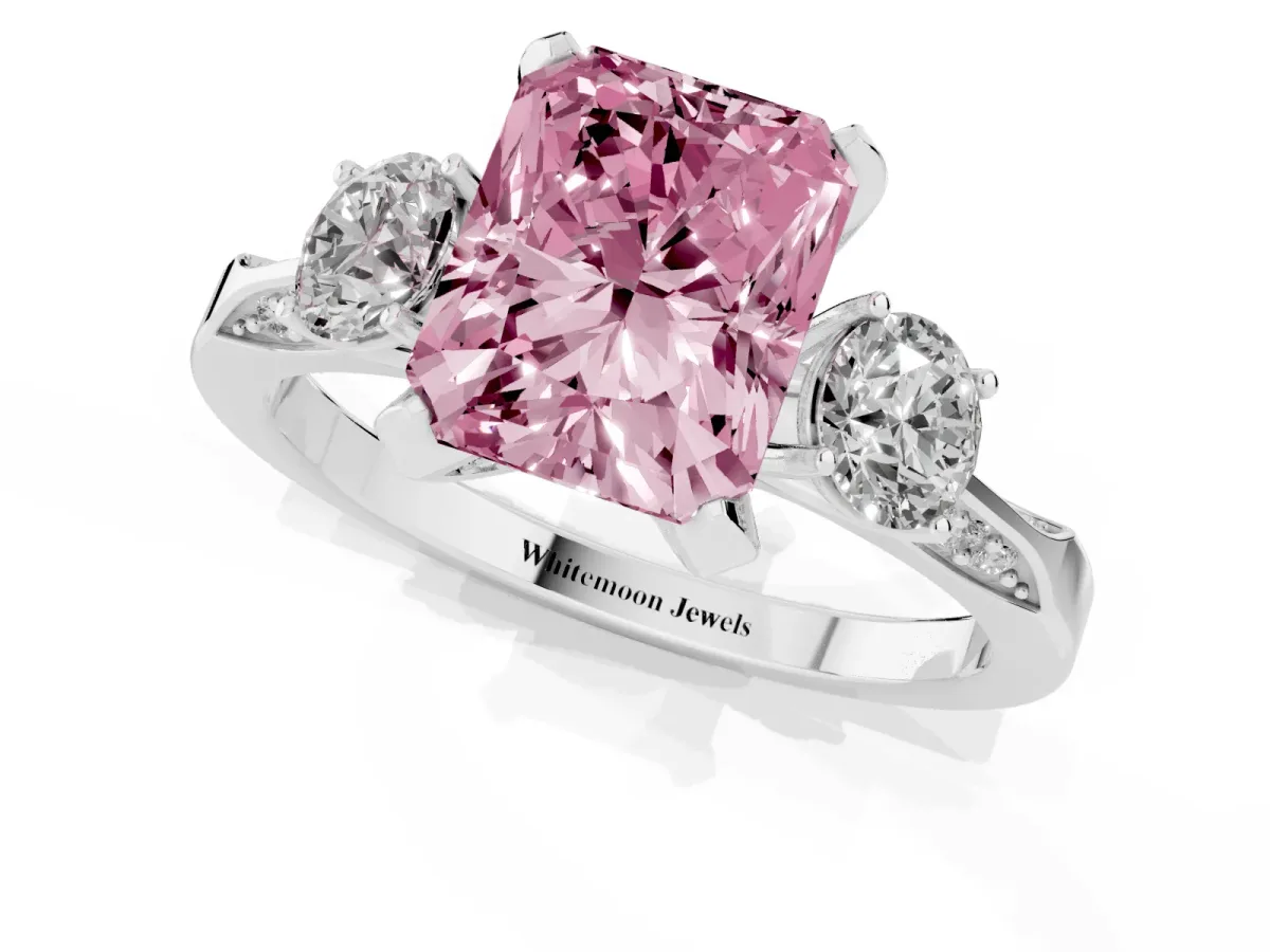 Fancy Pink Radiant Cut Brilliant Three-Stone Diamond Ring with Pavé Band and Four-Prong Setting White gold