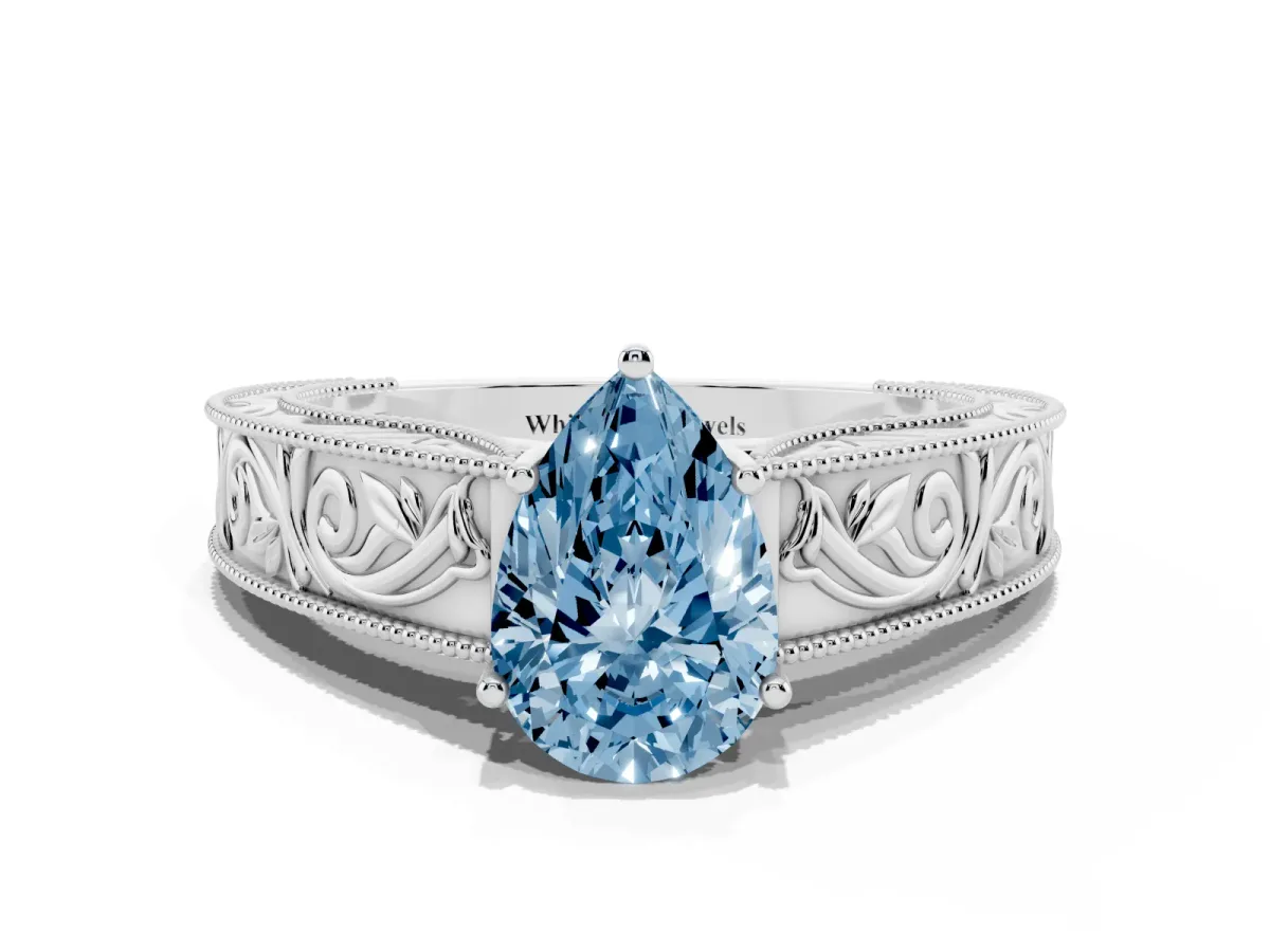 Fancy Blue Pear Cut Diamond Solitaire Ring with Engraved Band and Four-Prong Setting White gold