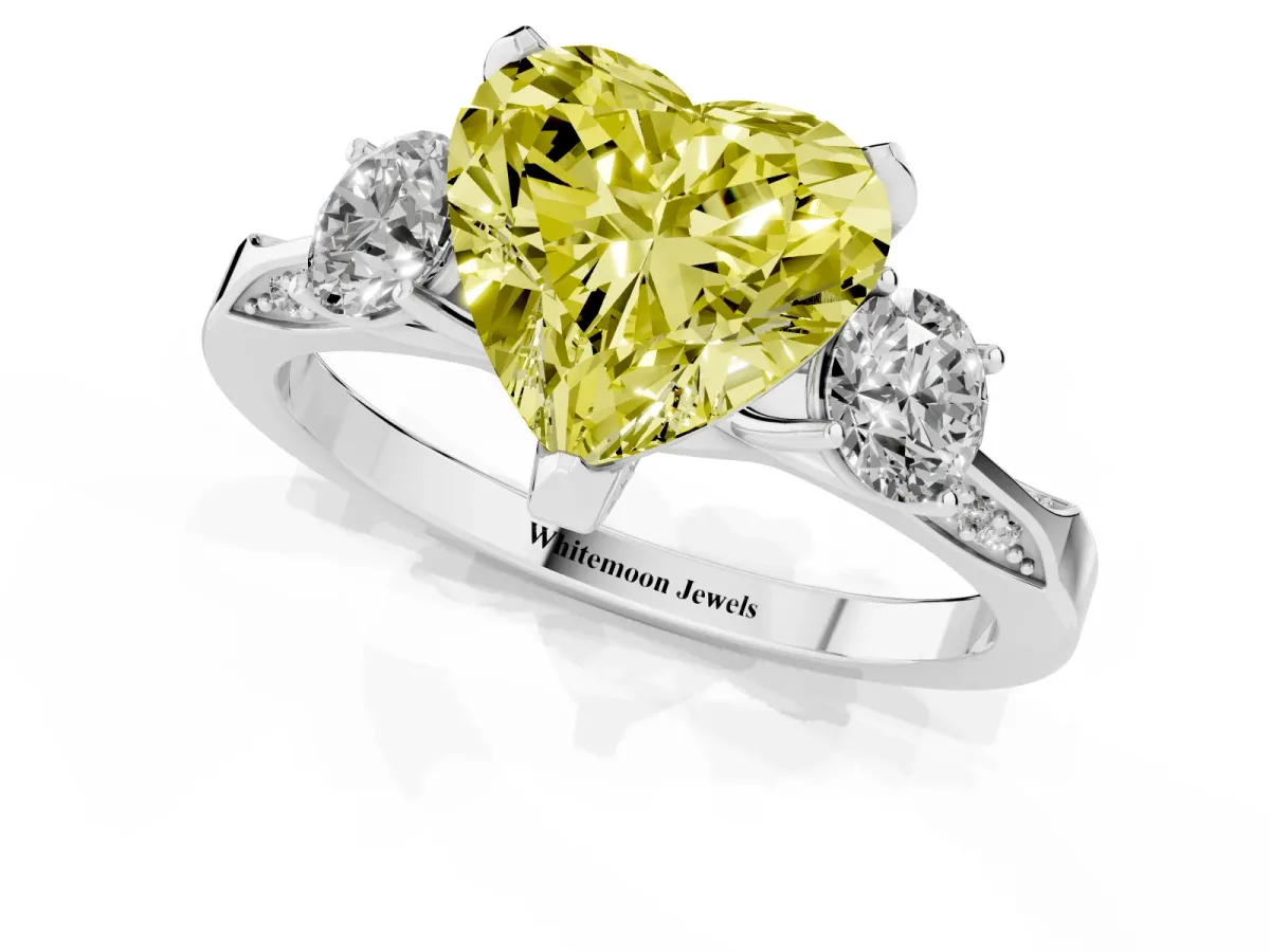 Fancy Yellow Heart Cut Brilliant Three-Stone Diamond Ring with Pavé Band and Four-Prong Setting Silver