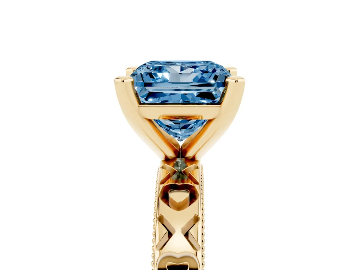 Fancy Blue Princess Cut Solitaire Diamond Engagement Ring with XO Engraved Band and Four-Prong Setting Yellow gold