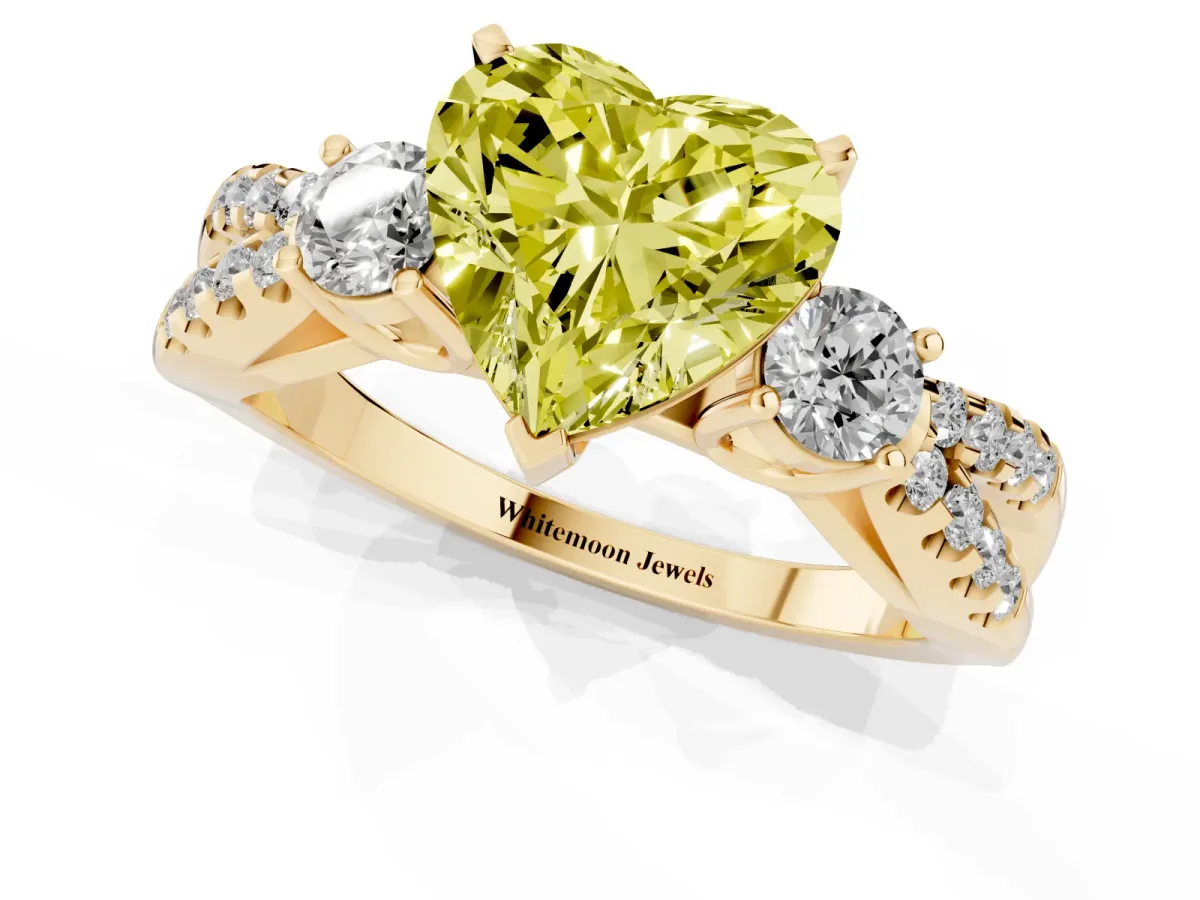 Fancy Yellow Heart Cut Diamond Three-Stone Ring with Pavé Split Shank and Four-Prong Setting Yellow gold