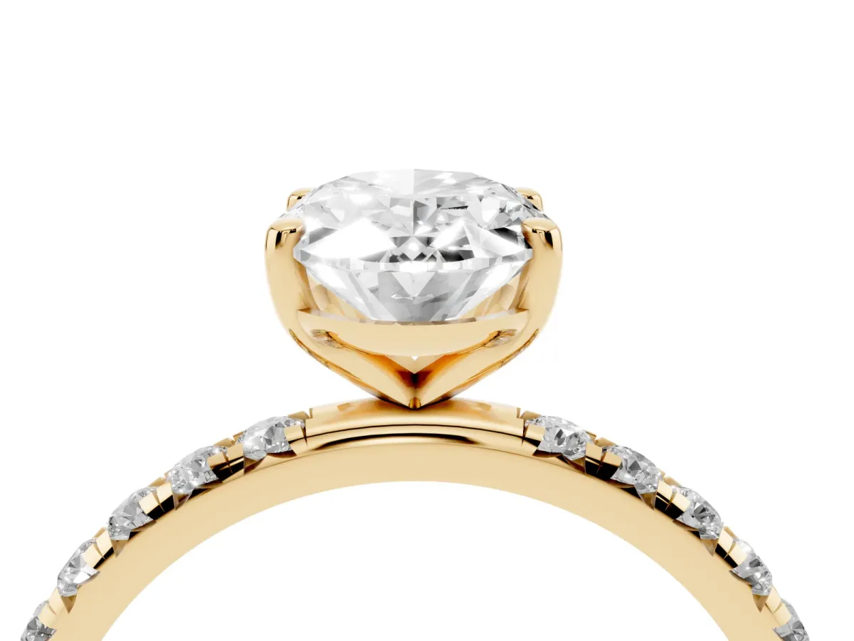 Oval Cut Cut Diamond Solitaire Ring with Micro Pave Band and Four Prong Setting Yellow gold