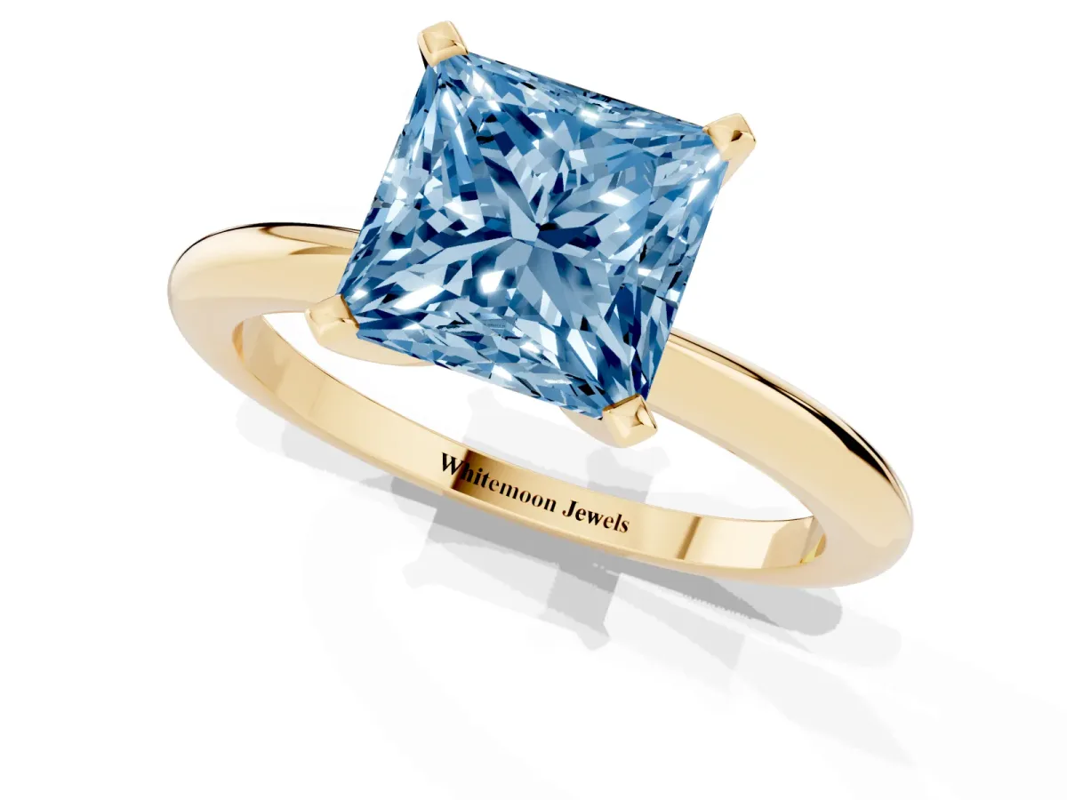 Fancy Blue Princess Cut Diamond Solitaire Ring with Prong Setting and Classic Band Yellow gold