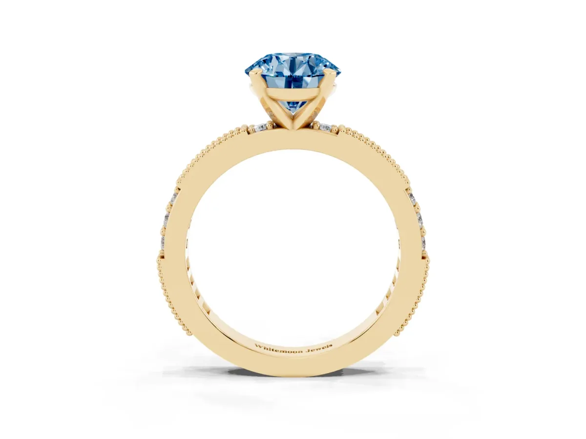 Fancy Blue Round Cut Solitaire with Pavé Band and Four-Prong Setting Yellow gold