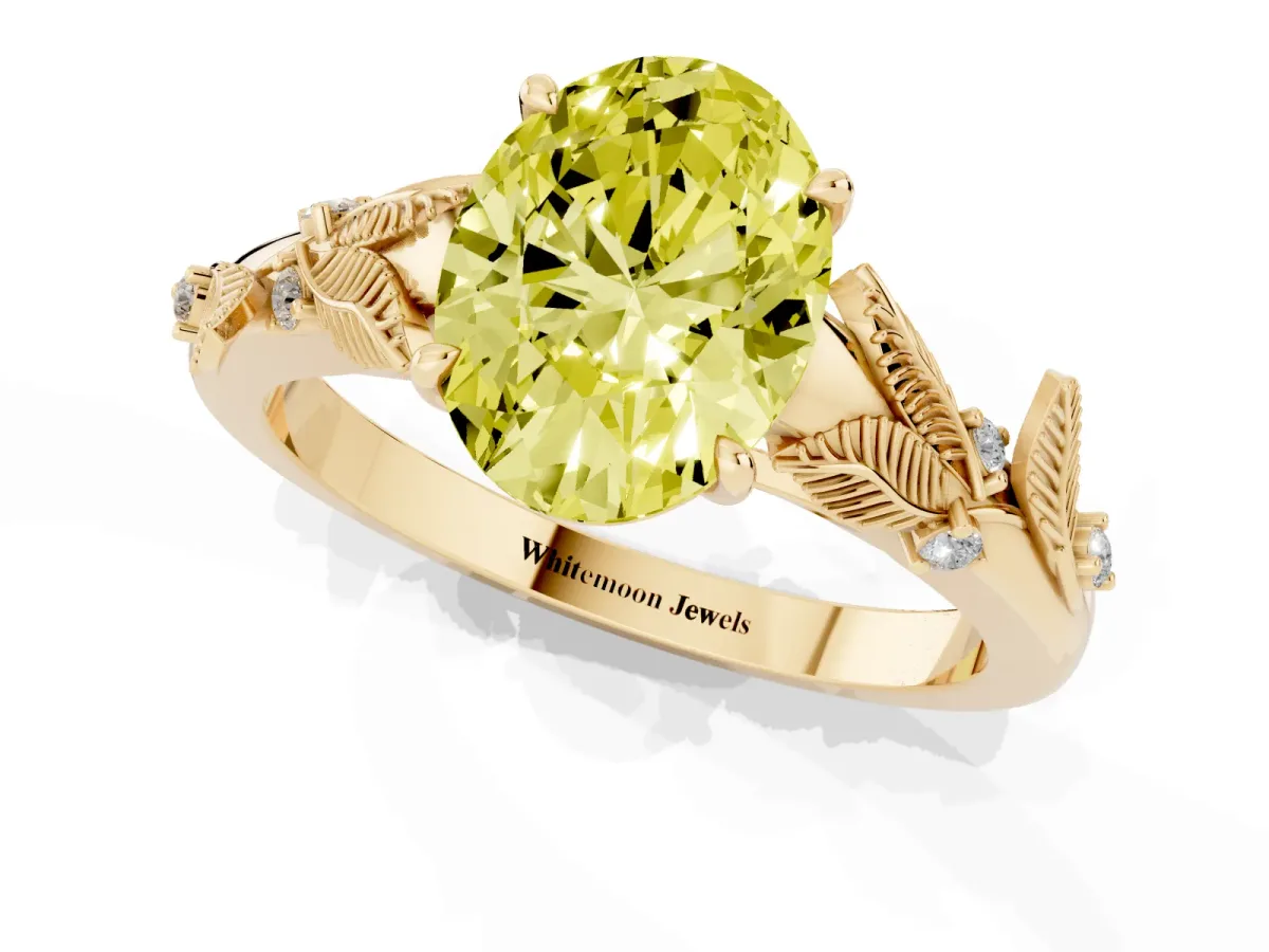 Fancy Yellow Oval Cut Diamond Solitaire Ring with Leaf Motif Band and Four-Prong Setting Yellow gold