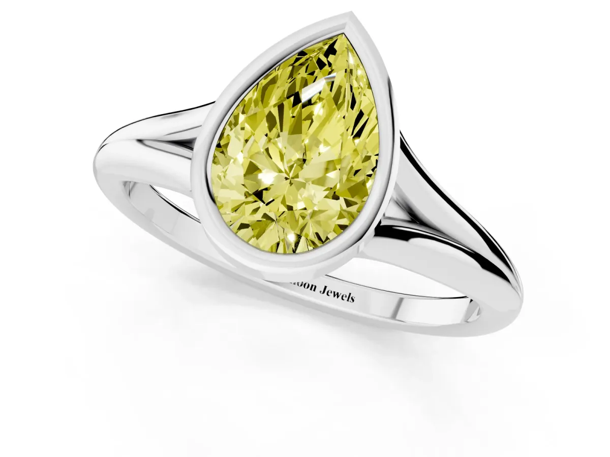 Fancy Yellow Bezel Set Pear Cut Cut Solitaire Ring with Tapered Band Silver