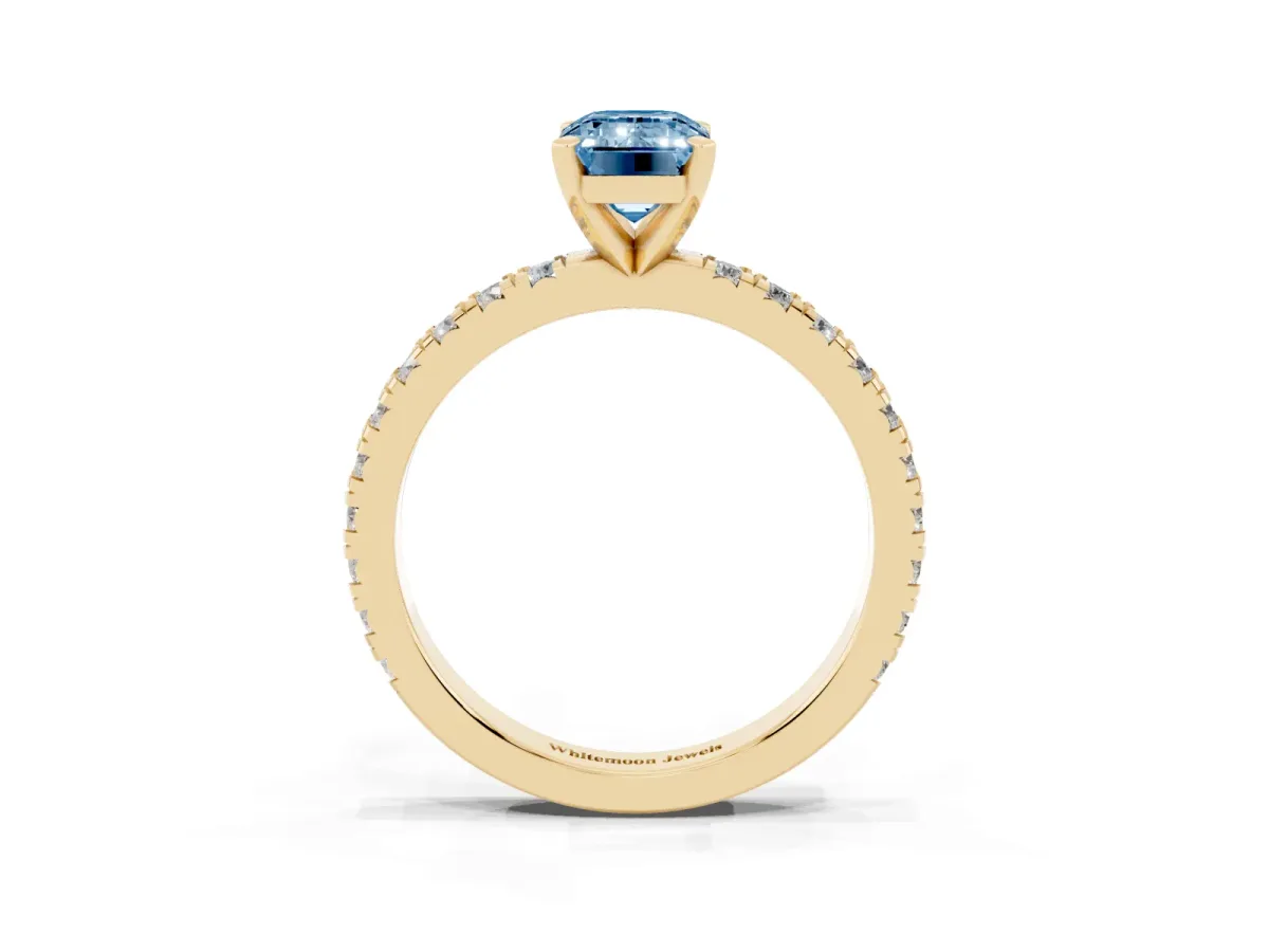 Fancy Blue Emerald Cut Diamond Pavé Band Solitaire with Four-Prong Setting Yellow gold