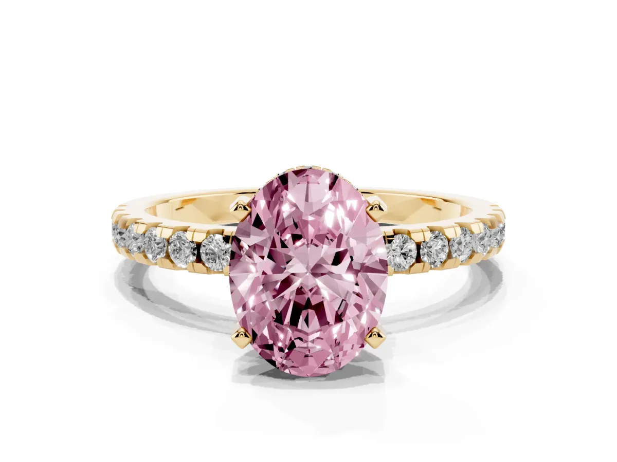 Fancy Pink Oval Cut Diamond Solitaire Ring with Round Pavé Band and Four-Prong Setting Yellow gold