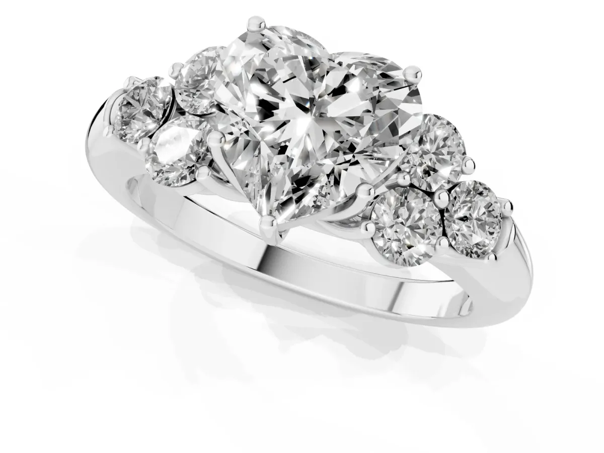 Heart Cut Cut Diamond Cluster Ring with Round Accent Stones and Prong Setting on a Classic Band White gold