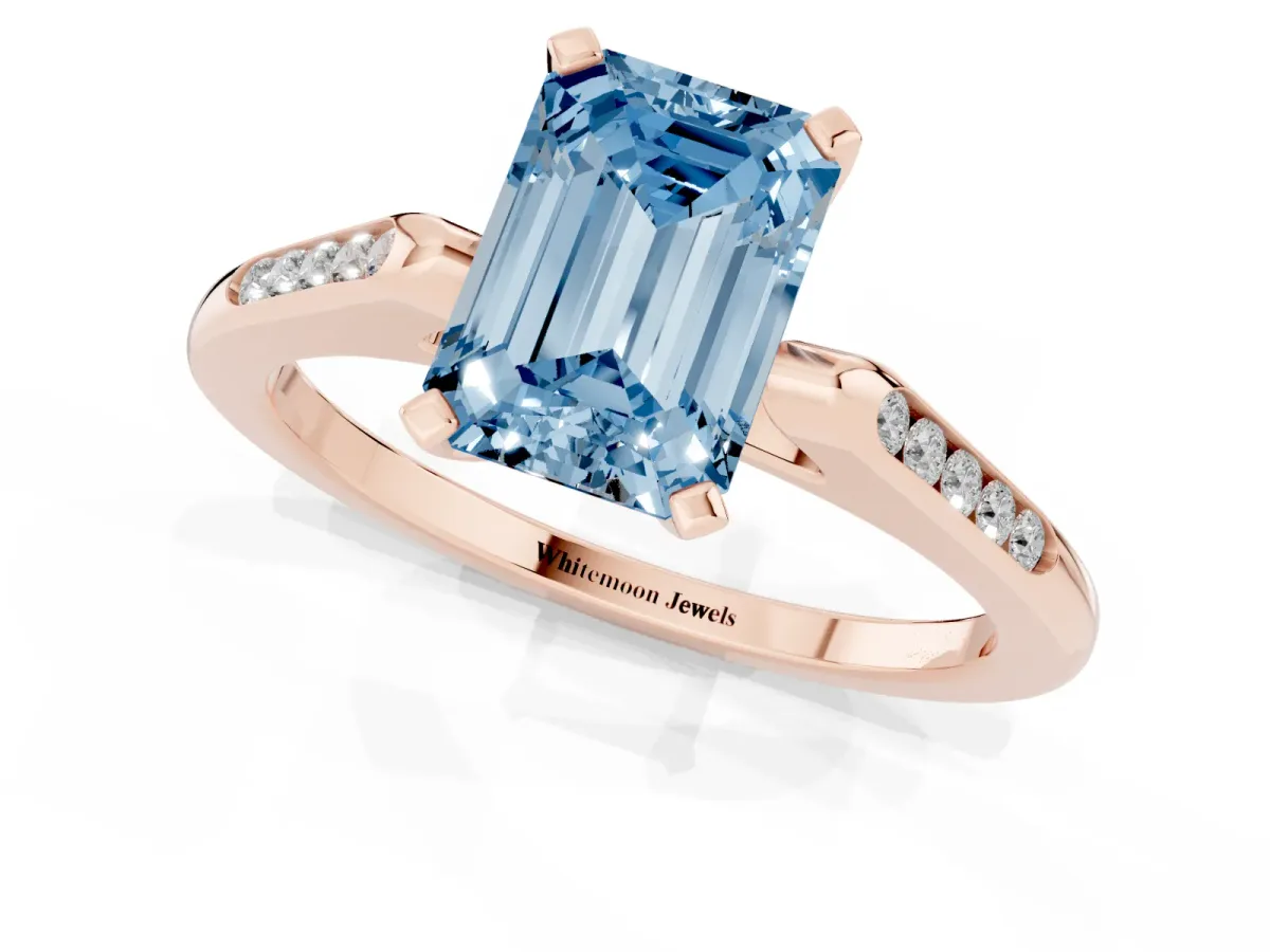 Fancy Blue Emerald Cut Diamond Solitaire Ring with Channel Set Round Band and Prong Setting Rose gold