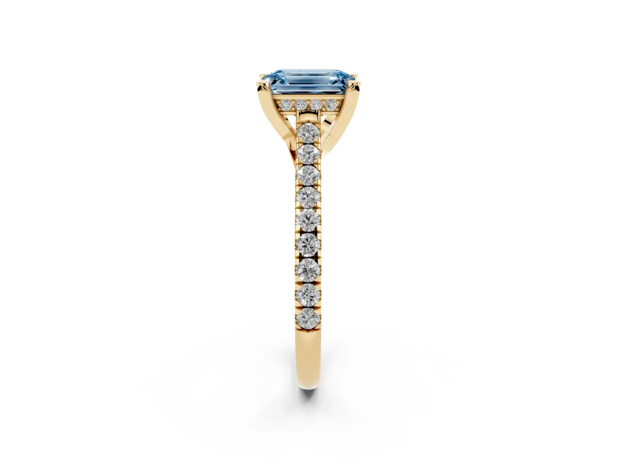 Fancy Blue Emerald Cut Brilliant Diamond Solitaire with Pavé Band and Four-Prong Setting Yellow gold