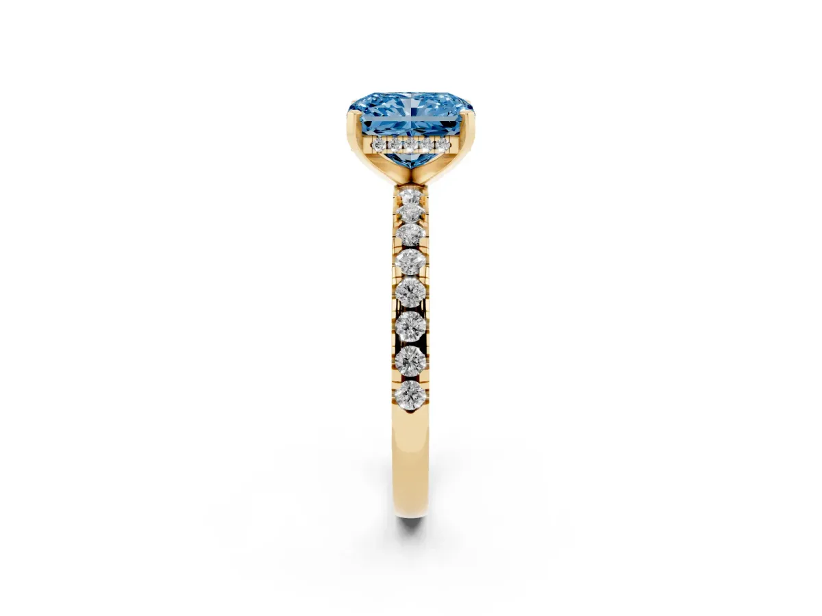 Fancy Blue Radiant Cut Diamond Solitaire Ring with Round Pavé Band and Four-Prong Setting Yellow gold