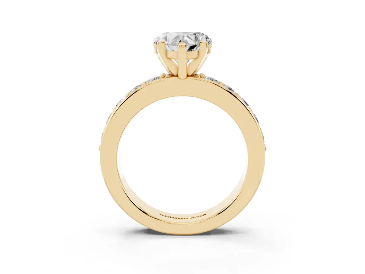 Heart Cut Diamond Engagement Ring with Channel Set Round Band and Prong Setting Yellow gold