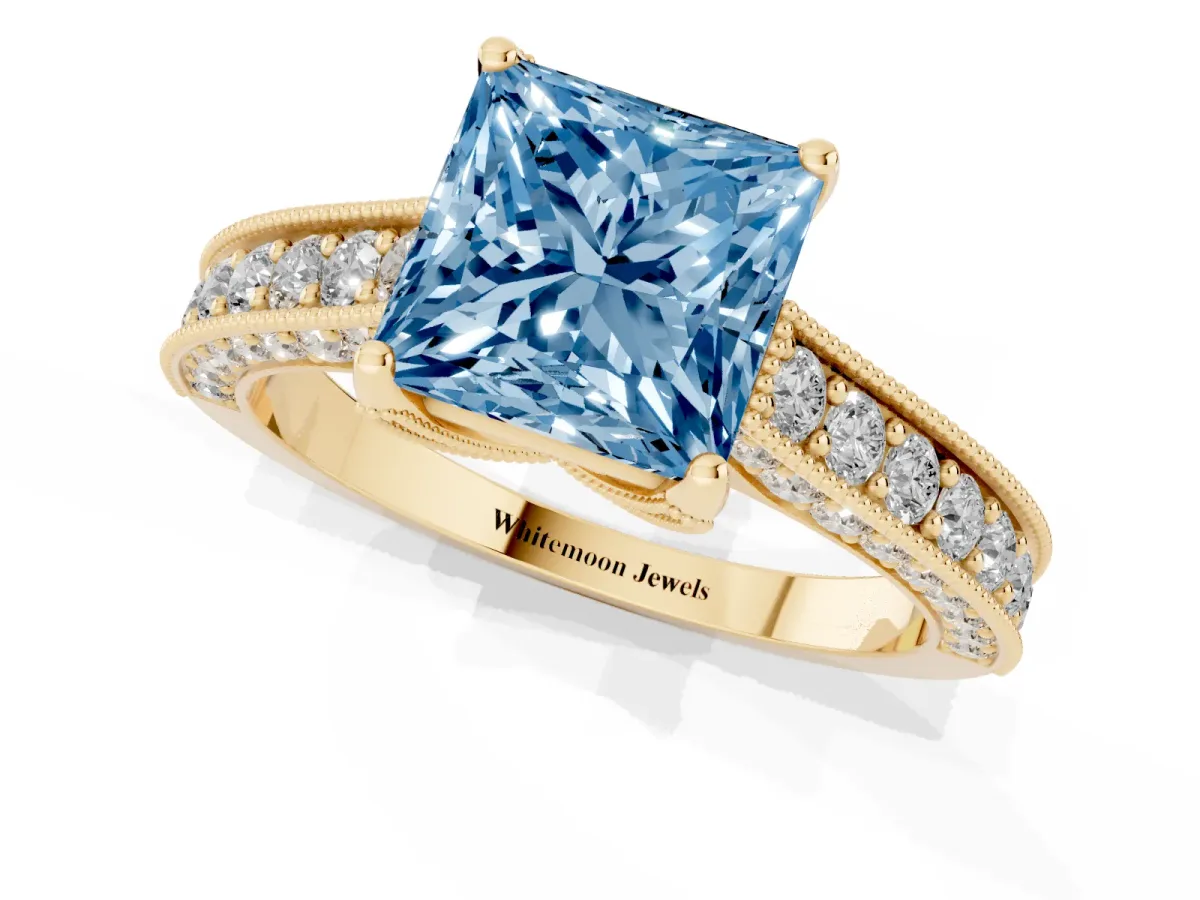 Fancy Blue Princess Cut Cut Diamond Solitaire Ring with Milgrain Pave Band and Four Prong Setting Yellow gold