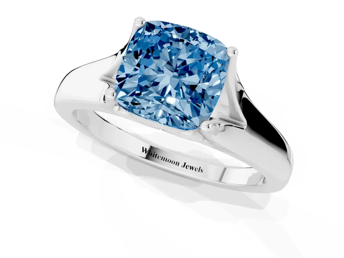 Fancy Blue Cushion Cut Solitaire Diamond Ring with Cathedral Band and Four-Prong Setting Silver