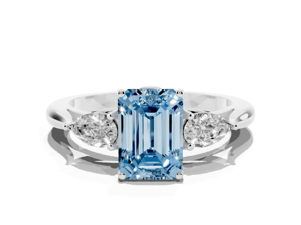 Fancy Blue Three-Stone Emerald Cut Brilliant Diamond Solitaire Ring with Tapered Band and Four-Prong Setting White gold