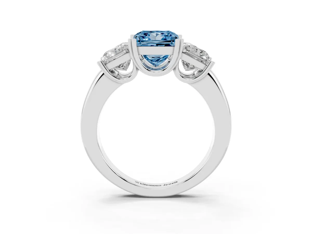 Fancy Blue Three-Stone Princess Cut Cut Diamond Ring with Channel Set Band and Four-Prong Setting Platinum