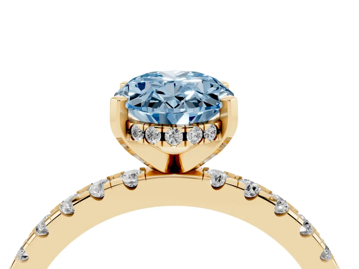 Fancy Blue Oval Cut Diamond Solitaire Ring with Round Pavé Band and Four-Prong Setting Yellow gold