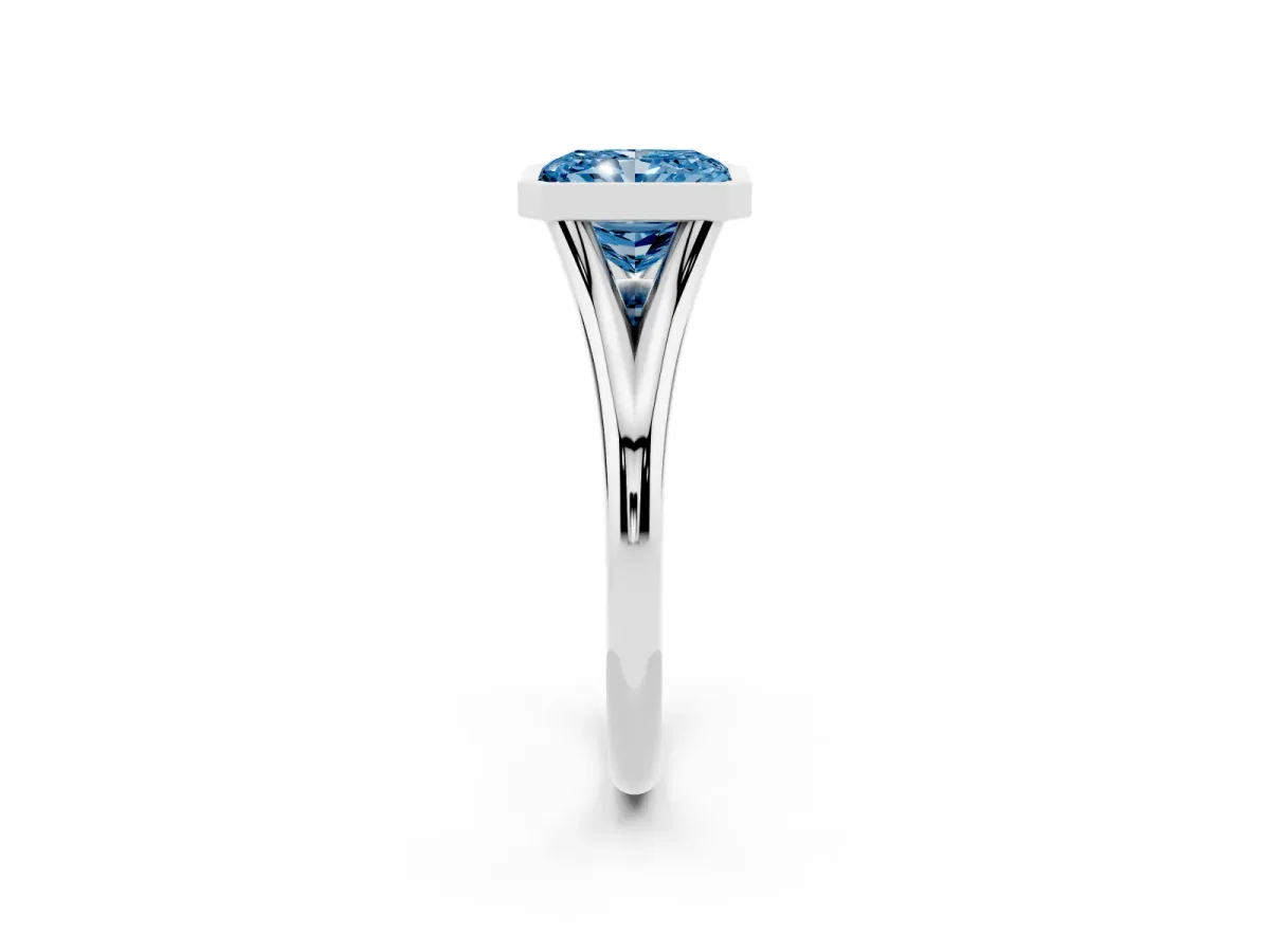 Fancy Blue Bezel Set Radiant Cut Cut Solitaire Ring with Tapered Band Silver