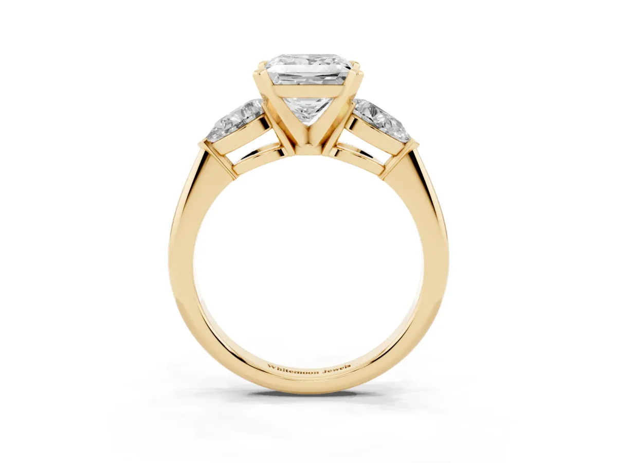 Three-Stone Princess Cut Diamond Ring with Pear Side Stones and Four-Prong Setting Yellow gold
