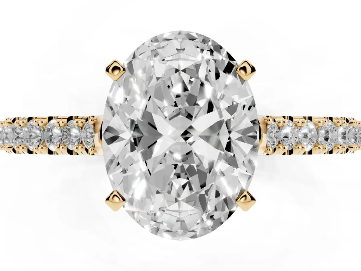 Oval Cut Cut Solitaire Diamond Engagement Ring with Pave Band and Four-Prong Setting Yellow gold