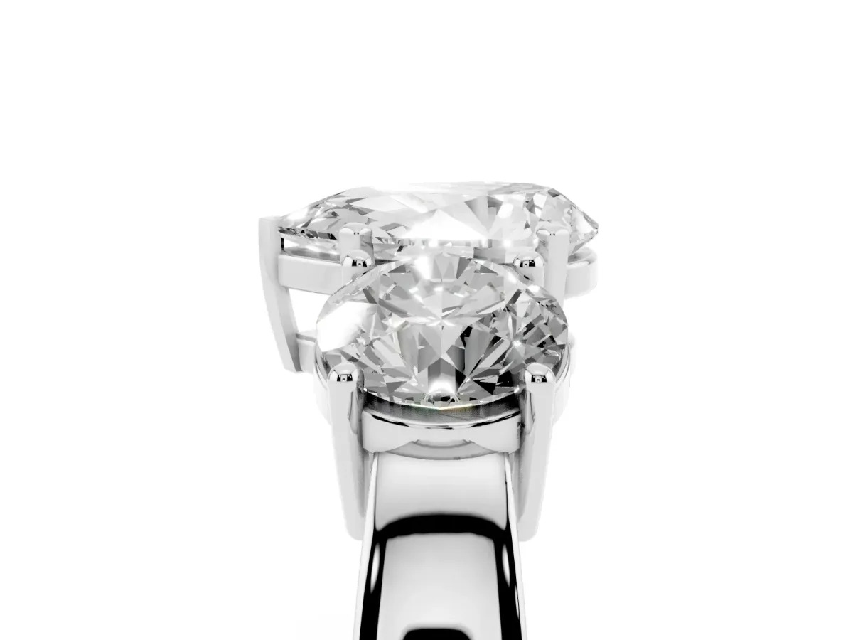 Three-Stone Pear Cut Diamond Ring with Round Side Stones, Classic Band, and Four-Prong Setting Platinum