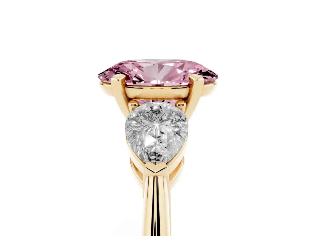 Fancy Pink Three-Stone Oval Cut Diamond Ring with Pear Side Stones and Four-Prong Setting Yellow gold
